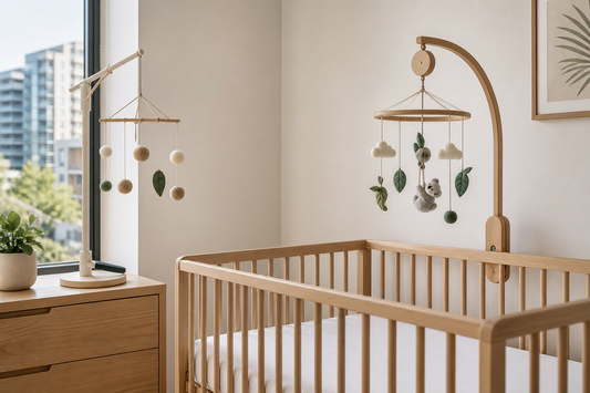 Soft modern Australian nursery comparing a baby mobile and cot mobile above a clear cot