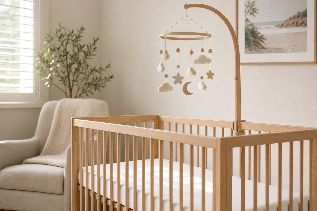 Soft modern Australian nursery with a secure cot mobile above a clear cot
