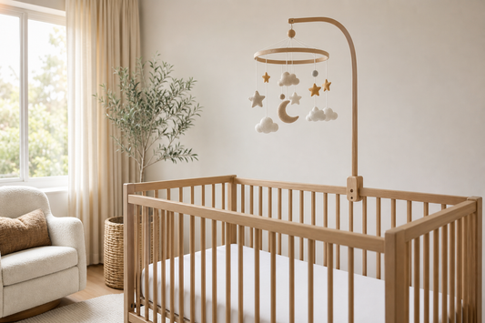 Modern Australian nursery with a cot mobile mounted safely above a clear cot