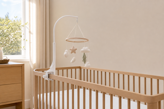 Modern Australian nursery with a no-drill cot mobile hanger secured to a clear cot