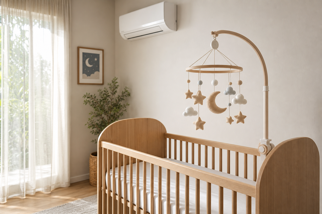 Soft modern Australian nursery with a secure cot mobile away from direct air conditioning
