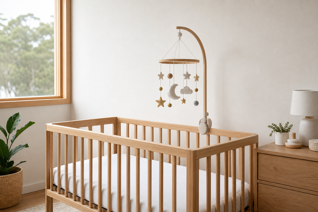 Soft modern Australian nursery with a cot mobile placed safely out of reach